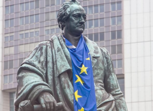 a statue of a man with a blue scarf around his neck