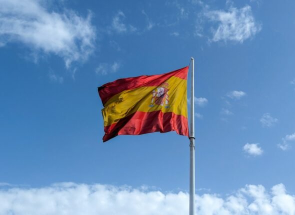 A flag flying in the wind on a sunny day