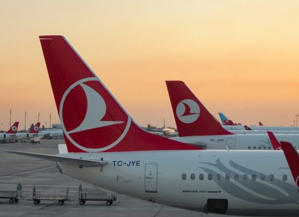 a couple of airplanes at an airport